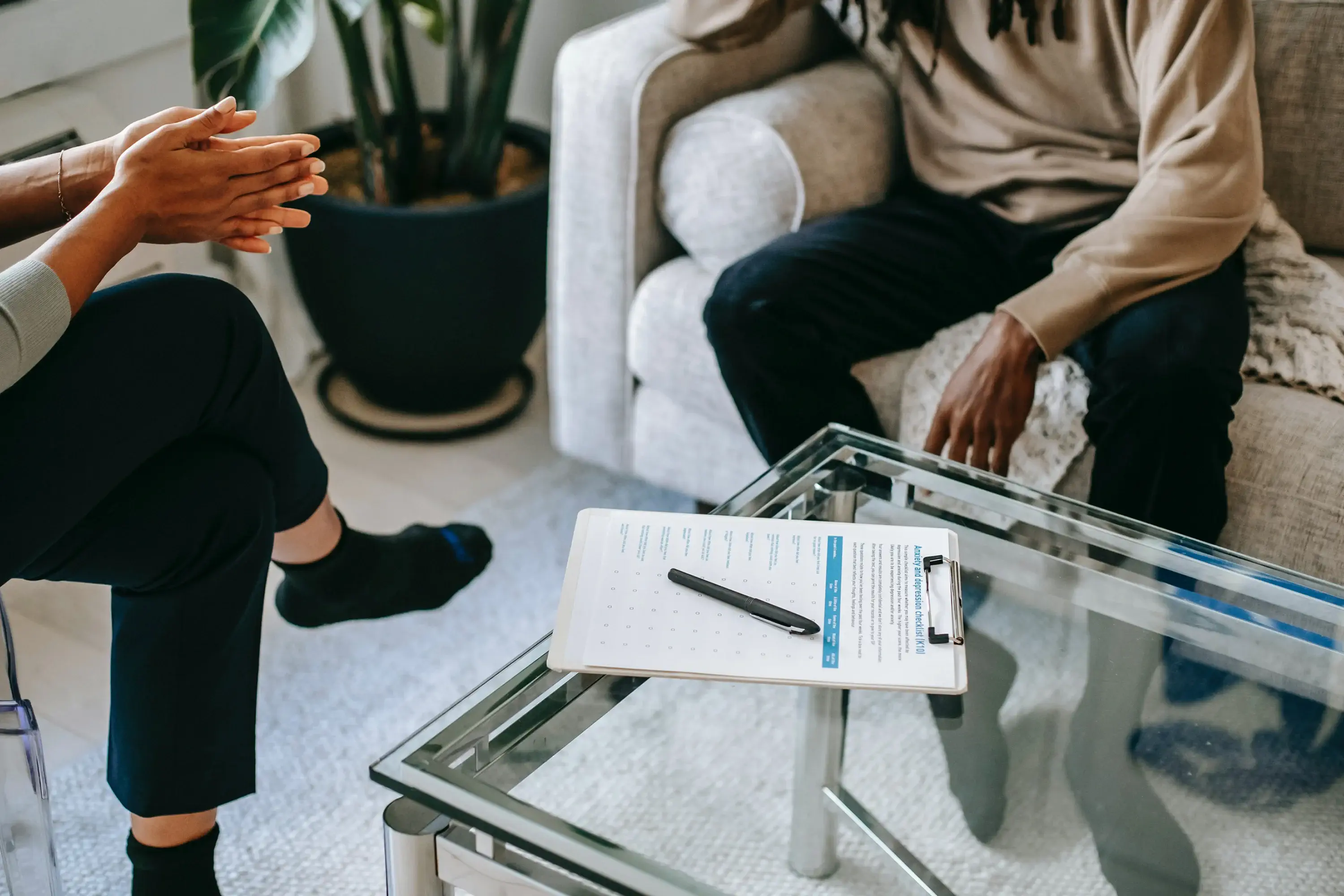 two people talking in a therapy office